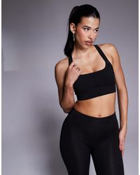 4505 - Icon Medium Support Square Neck Sports Bra With Adjustable Straps - Lyst