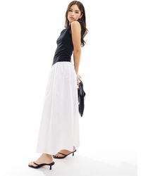 ASOS - Vestido largo negro y blanco marfil con diseño en contraste y falda - Lyst
