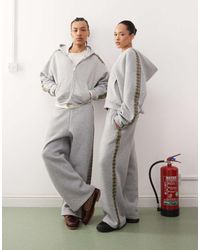 Reclaimed (vintage) - Uniseks Joggingbroek Met Wijde Pijpen En Geruite Zijstreep - Lyst