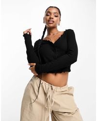 Monki - Ribbed Button Front Long Sleeve Top With Lettuce Edge - Lyst