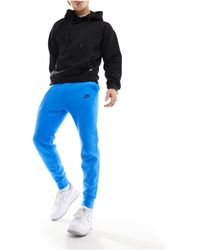 Nike - Joggers azules tech fleece - Lyst