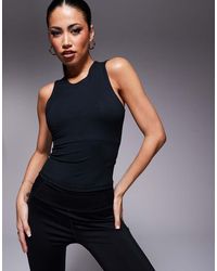 4505 - Icon High Neck Vest With Inner Bra And Removable Padding - Lyst