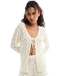 Miss Selfridge - Gilet d'ensemble en maille pointelle avec liens noués à l'avant et manches évasées - crème - Lyst
