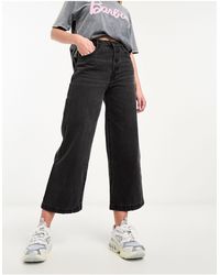 Pimkie - Jeans a fondo ampio e vita alta neri con bottoni a vista - Lyst