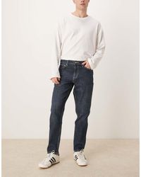 ASOS - Vaqueros Tapered Azules Con Lavado Oscuro De Corte Elástico De - Lyst