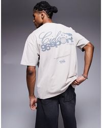 ASOS - T-shirt oversize coupe carrée avec texte sportif imprimé en tissu épais 220 g/m2 - beige délavé - Lyst