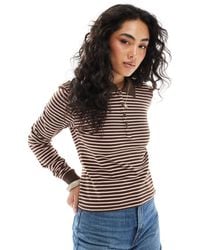 Monki - – langärmliges pikee-polohemd - Lyst