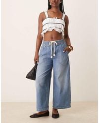 Free People - Jeans A Cilindro Lavaggio Medio Con Laccio - Lyst