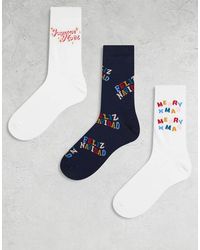 ASOS - Pack De 3 Pares De Calcetines De Varios Colores Para Navidad Con Estampado Gráfico "Feliz Navidad" De - Lyst