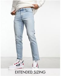 ASOS - Jeans affusolati lavaggio chiaro - Lyst