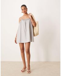 Motel - Kamalani - robe babydoll courte à carreaux vichy - gris - Lyst