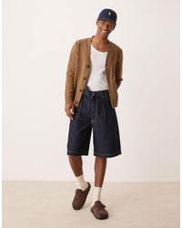 ASOS - Bermuda long en jean à pinces avec liens noués à la taille - brut délavé - Lyst