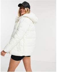 monki amber recycled short padded jacket with hood in blue