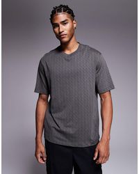 ARMANI EXCHANGE - T-shirt manches courtes avec logo sur l'ensemble - Lyst