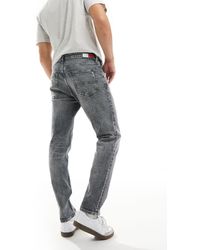 Tommy Hilfiger - Austin - jeans slim affusolati lavaggio scuro - Lyst