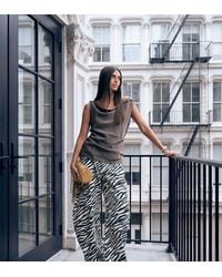Lioness - Exclusive Horseshoe Barrel Leg Jeans - Lyst