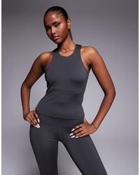 4505 - Icon Active Racer Back Singlet With Inner Bra And Removable Padding - Lyst