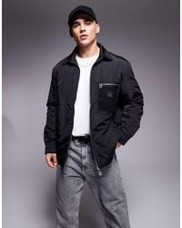 ARMANI EXCHANGE - Chaqueta Negra Estilo Camisa Acolchada Con Bolsillo Con Cremallera De - Lyst