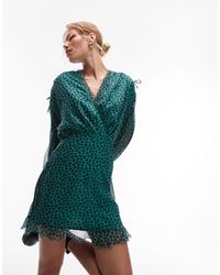 TOPSHOP - Robe rétro courte avec col à volants et coutures effilochées - vert et noir à fleurs - Lyst