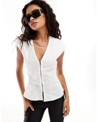 Weekday - Sleeveless Blouse Top With V Neck And Hook And Bar Corset Waist Detail - Lyst