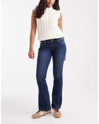 Hollister - Low Rise Bootcut Jeans - Lyst