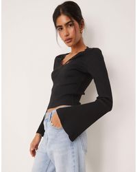 ASOS - Rib V Neck Top With Lace Trim And Flared Sleeve - Lyst