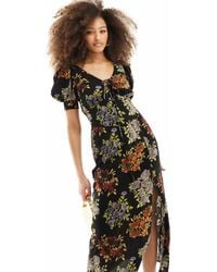 ASOS - Robe mi-longue à manches bouffantes et imprimé fleuri vintage avec liens noués à l'avant - noir - Lyst