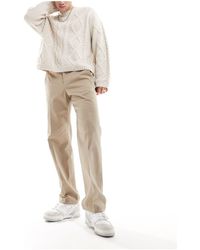 SELECTED - Pantalones beis sueltos - Lyst
