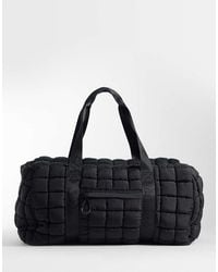 4505 - Oversized Quilted Woven Gym Duffel Bag - Lyst