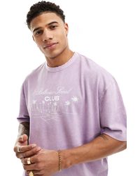 ASOS - Camiseta lila lavado extragrande con estampado deportivo delantero - Lyst