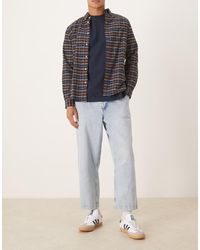 ASOS - Relaxed Tapered Pleated Jeans - Lyst