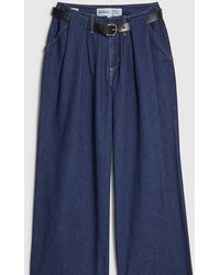 River Island - Petite Belted Pleated Wide Leg Jeans - Lyst