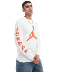 Nike - T-Shirt Met Lange Mouwen En Vlammend Logo - Lyst