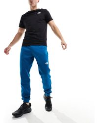 The North Face - Training reaxion - joggers mélange con logo - Lyst