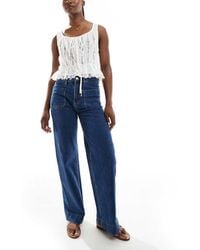 Bershka - Jeans A Vita Alta Lavaggio Medio Con Tasche - Lyst
