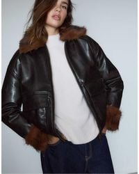 Stradivarius - Leather Effect Padded Jacket With Faux Fur Details - Lyst