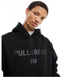 Pull&Bear - Felpa nera con cappuccio e stampa tono su tono - Lyst
