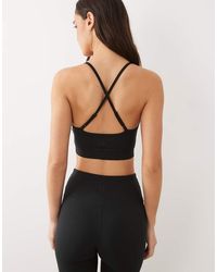 4505 - Icon Light Support Sports Bra With Adjustable Straps - Lyst