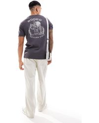 ASOS - Camiseta extragrande con estampado escénico en la espalda - Lyst