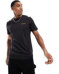 Timberland - T-Shirt Nera Con Scritta Piccola Del Logo - Lyst