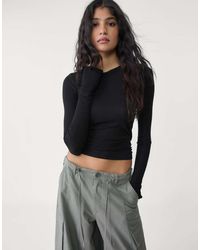Stradivarius - Geribbeld T-Shirt Met Lange Mouwen - Lyst