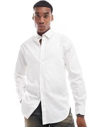 ARMANI EXCHANGE - Chemise à manches longues en satin brillant avec logo sur l'ensemble - cassé - Lyst