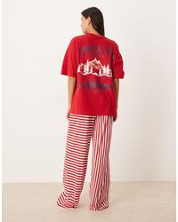 ASOS - – pyjama aus oversize-t-shirt mit "après ski"-grafikprint und hose mit weitem bein - Lyst