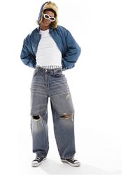 Pull&Bear - Jeans skater stile cargo slavato con strappi - Lyst