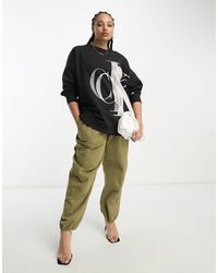 Calvin Klein - Plus - felpa nera con logo a monogramma - Lyst