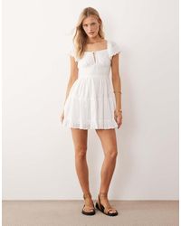 Iisla & Bird - Broderie Mini Beach Dress - Lyst