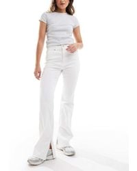 Stradivarius - D74 Flare Slit Jean - Lyst