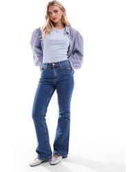 ASOS - Asos design petite - jean évasé à taille mi-haute - moyen - Lyst