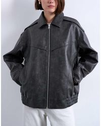 TOPSHOP - Chaqueta Bomber Negra Extragrande Con Lavado Envejecido, Cremallera Y Detalle De Costuras De Cuero Sintético De -Negro - Lyst