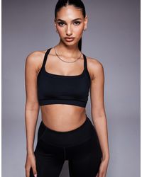 4505 - Icon Medium Support Square Neck Sports Bra With Adjustable Straps - Lyst
